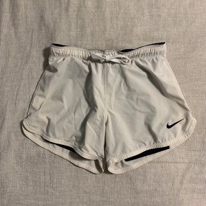 White Nike running shorts
